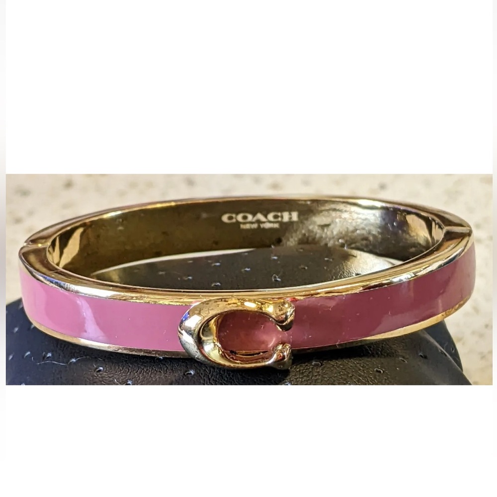 COACH SIGNATURE “C” BANGLE BRACELET DARK MAUVE AND GOLD TONED.